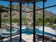 Stunning mountain views are framed by expansive windows in this well-appointed living room at 5040 N Arcadia Dr, Phoenix, AZ 85018