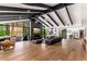 Expansive living room with floor-to-ceiling windows, sleek fireplace, and open floor plan at 5040 N Arcadia Dr, Phoenix, AZ 85018
