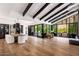 Open-concept room with high ceilings, large windows, and seamless indoor-outdoor flow at 5040 N Arcadia Dr, Phoenix, AZ 85018