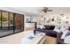 This living room offers comfortable seating, backyard access, and built-in shelves for storage at 5040 N Arcadia Dr, Phoenix, AZ 85018