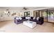 Comfortable living room features a plush sofa, built in shelving, and access to the backyard at 5040 N Arcadia Dr, Phoenix, AZ 85018