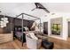 This spacious main bedroom boasts modern decor, wooden floors, and a unique lighting fixture at 5040 N Arcadia Dr, Phoenix, AZ 85018