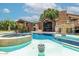 Resort-style backyard featuring an oversized pool, spa, and covered outdoor dining space at 5040 N Arcadia Dr, Phoenix, AZ 85018