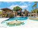 A stunning backyard oasis with multiple water features, lush landscaping, and comfortable seating at 5040 N Arcadia Dr, Phoenix, AZ 85018