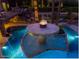Custom pool with a fire feature, palm trees, and lush landscaping, creating a resort-like atmosphere at 5040 N Arcadia Dr, Phoenix, AZ 85018