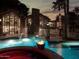 Backyard pool with a fire feature, hot tub, and modern home architecture creates an inviting outdoor space at 5040 N Arcadia Dr, Phoenix, AZ 85018