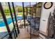 Modern staircase with steel railing and walls of glass offering views of the pool and grounds at 5040 N Arcadia Dr, Phoenix, AZ 85018