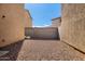 Home's side yard features a block wall and rock ground cover at 5233 W Albeniz Pl, Phoenix, AZ 85043