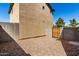 Backyard with wooden gate in block wall, providing a private outdoor space at 5233 W Albeniz Pl, Phoenix, AZ 85043