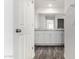 Bathroom featuring double sinks with granite countertops and wood floors at 5233 W Albeniz Pl, Phoenix, AZ 85043