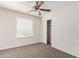 Cozy bedroom featuring a ceiling fan, window with blinds, and closet at 5233 W Albeniz Pl, Phoenix, AZ 85043