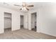 Bedroom featuring neutral carpet, a ceiling fan, and a closet at 5233 W Albeniz Pl, Phoenix, AZ 85043