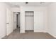 Bedroom featuring a sliding door closet, neutral walls, and carpeted floors at 5233 W Albeniz Pl, Phoenix, AZ 85043
