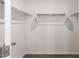 Walk-in closet with white shelving and clothing rods at 5233 W Albeniz Pl, Phoenix, AZ 85043