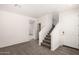 Entryway with gray carpet, white walls, and a staircase leading to the second floor at 5233 W Albeniz Pl, Phoenix, AZ 85043