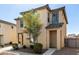 Two-story home with desert landscaping, showing a covered entryway at 5233 W Albeniz Pl, Phoenix, AZ 85043