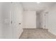 This hallway is carpeted and has a double door closet at 5233 W Albeniz Pl, Phoenix, AZ 85043