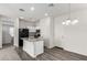 A cozy eat-in kitchen featuring a breakfast bar, seamlessly blends into a naturally-lit dining and living area at 5233 W Albeniz Pl, Phoenix, AZ 85043