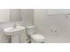 Powder bathroom with modern sink and toilet, complemented by neutral paint and accents at 5472 W Fulton St, Phoenix, AZ 85043
