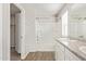 Bright bathroom featuring a shower/tub combo and a vanity with a countertop at 5472 W Fulton St, Phoenix, AZ 85043