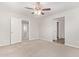 Bedroom with neutral carpet and open doorways to other areas of the home at 5472 W Fulton St, Phoenix, AZ 85043