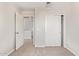 Bedroom featuring a closet and door leading to hallway at 5472 W Fulton St, Phoenix, AZ 85043