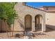 Inviting entrance featuring a covered entryway with arched detailing and a well-maintained walkway at 5472 W Fulton St, Phoenix, AZ 85043