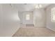 Neutral-toned entry with plush carpet, chandelier, and window at 5472 W Fulton St, Phoenix, AZ 85043