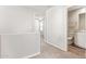 Upstairs hallway leading to bedroom and bathroom at 5472 W Fulton St, Phoenix, AZ 85043