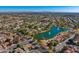 Wide aerial view of a community showcasing attractive homes surrounding a serene lake with water features at 5670 W Linda Ln, Chandler, AZ 85226