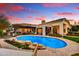 Gorgeous backyard featuring a sparkling pool, mature trees, built-in barbecue, and outdoor seating areas at 5670 W Linda Ln, Chandler, AZ 85226
