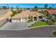 Beautiful home exterior with a three-car garage, well-manicured lawn, and attractive landscaping at 5670 W Linda Ln, Chandler, AZ 85226