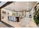 Spacious living and dining area with modern lighting, neutral tones, and a seamless indoor-outdoor flow at 5670 W Linda Ln, Chandler, AZ 85226