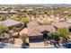 Aerial view of desert home showing the tile roof, desert landscaping, and hardscape in the backyard at 5709 E Sleepy Ranch Rd, Cave Creek, AZ 85331