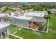Aerial view of the home featuring a backyard with a covered patio, lush green grass, and mature landscaping at 5801 N 25Th Pl, Phoenix, AZ 85016
