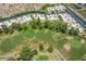 The aerial view shows the community adjacent to a golf course with water features at 5801 N 25Th Pl, Phoenix, AZ 85016