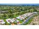 Aerial view highlighting the community's beautiful landscaping, well-maintained lawns, and proximity to the golf course at 5801 N 25Th Pl, Phoenix, AZ 85016