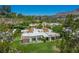 Expansive aerial view of the home surrounded by trees, manicured lawns, and other homes, showcasing a peaceful setting at 5801 N 25Th Pl, Phoenix, AZ 85016