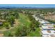 Aerial view showcasing the community's proximity to the golf course and lush green landscape at 5801 N 25Th Pl, Phoenix, AZ 85016