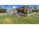 Well-maintained backyard with a covered patio, white fencing, and green grass, ideal for outdoor enjoyment at 5801 N 25Th Pl, Phoenix, AZ 85016