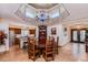 Elegant dining area with a brick ceiling and chandelier, open to a gourmet kitchen and living spaces at 5801 N 25Th Pl, Phoenix, AZ 85016