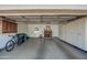 Spacious garage with epoxy floor, white built-in storage cabinets and room for parking at 5801 N 25Th Pl, Phoenix, AZ 85016