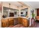 The kitchen features a granite breakfast bar that leads into a living room and dining room; perfect for entertaining at 5801 N 25Th Pl, Phoenix, AZ 85016