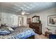 Comfortable main bedroom with large closet, ceiling fan, and decorative wooden dresser at 5801 N 25Th Pl, Phoenix, AZ 85016