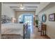 Bright main bedroom boasts beamed ceilings, travertine floors, and a sitting room with patio access at 5801 N 25Th Pl, Phoenix, AZ 85016