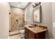 Bathroom featuring tiled walk-in shower and granite vanity at 6181 E Brilliant Sky Dr, Scottsdale, AZ 85266