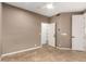 Bedroom with tile floors, neutral walls, and open closet at 6181 E Brilliant Sky Dr, Scottsdale, AZ 85266