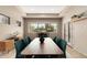 Elegant dining room with modern furnishings and a large window with desert views at 6181 E Brilliant Sky Dr, Scottsdale, AZ 85266