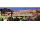 Desert landscaping surrounds resort clubhouse with outdoor patio, stairs, and mountain views at 6181 E Brilliant Sky Dr, Scottsdale, AZ 85266