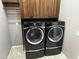 Modern laundry room with side-by-side washer and dryer at 6181 E Brilliant Sky Dr, Scottsdale, AZ 85266